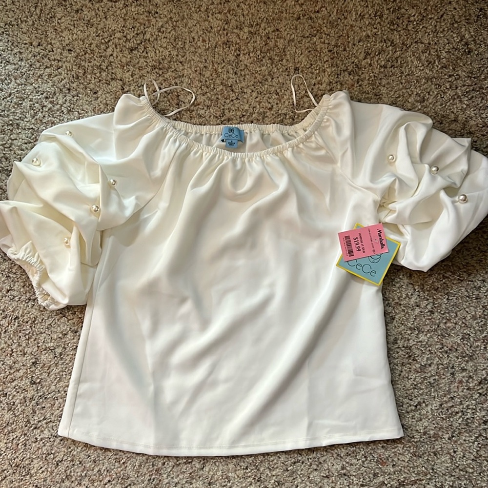 Jeweled-sleeve, white blouse. Pearl detail on sleeves.